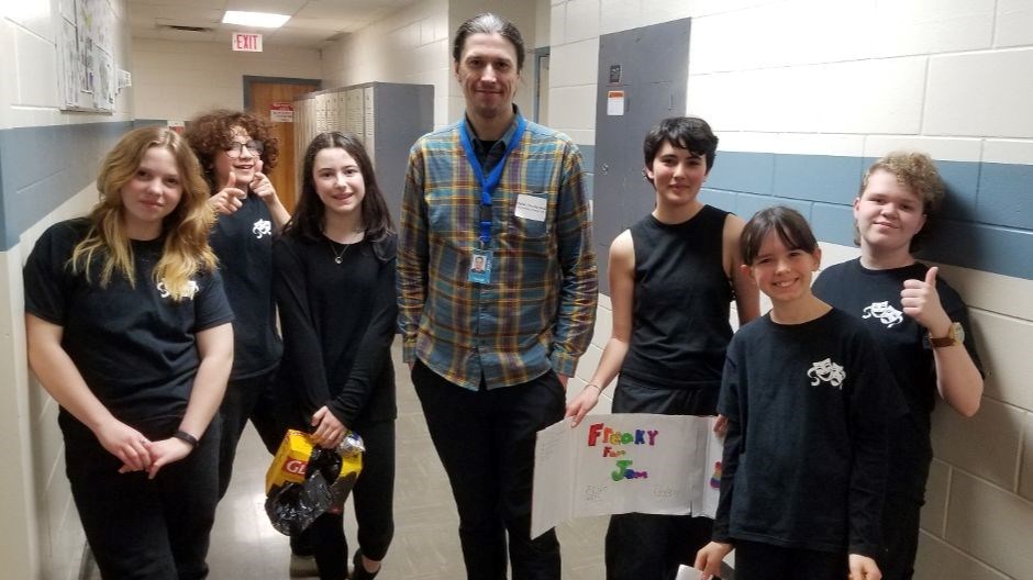 Destination Imagination Director and Host Adam Charbonneau (centre) had students and staff and their families up on their feet to open the event at École River Heights School March 15th. The STEAM (Science, Technology, Engineering, Art and Math) Support Teacher for the Winnipeg School Division is shown with Freaky Fram Jam, École River Heights team entry in the Fine Arts Challenge.